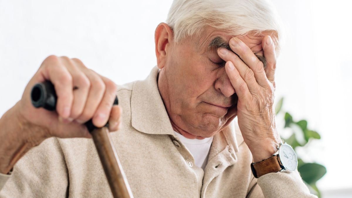 man with a cane tired