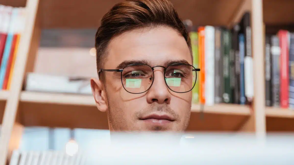 man with laptop and typing glasses