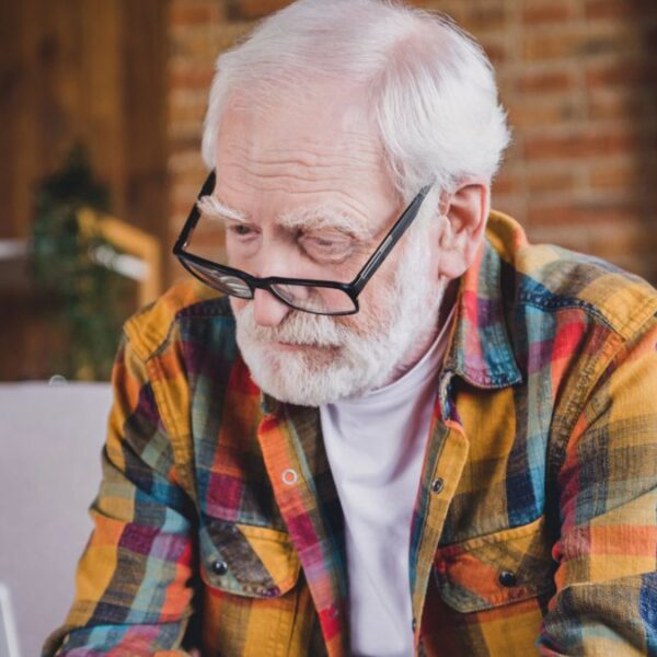 mature man glasses on a laptop