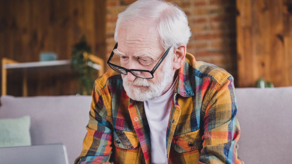 mature man glasses on a laptop