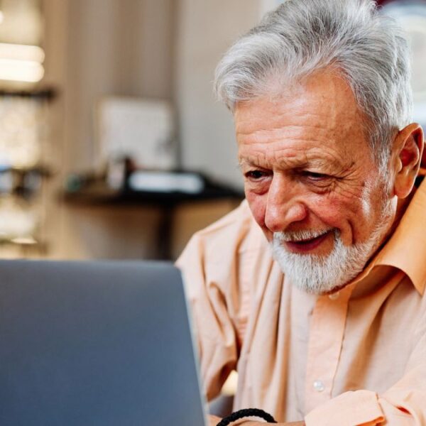 mature man looking at a laptop