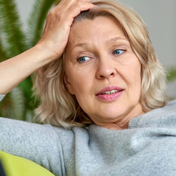 mature woman resting on her arm