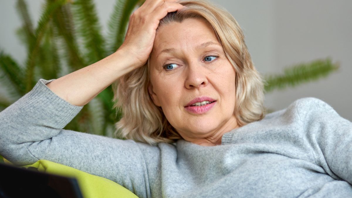 mature woman resting on her arm