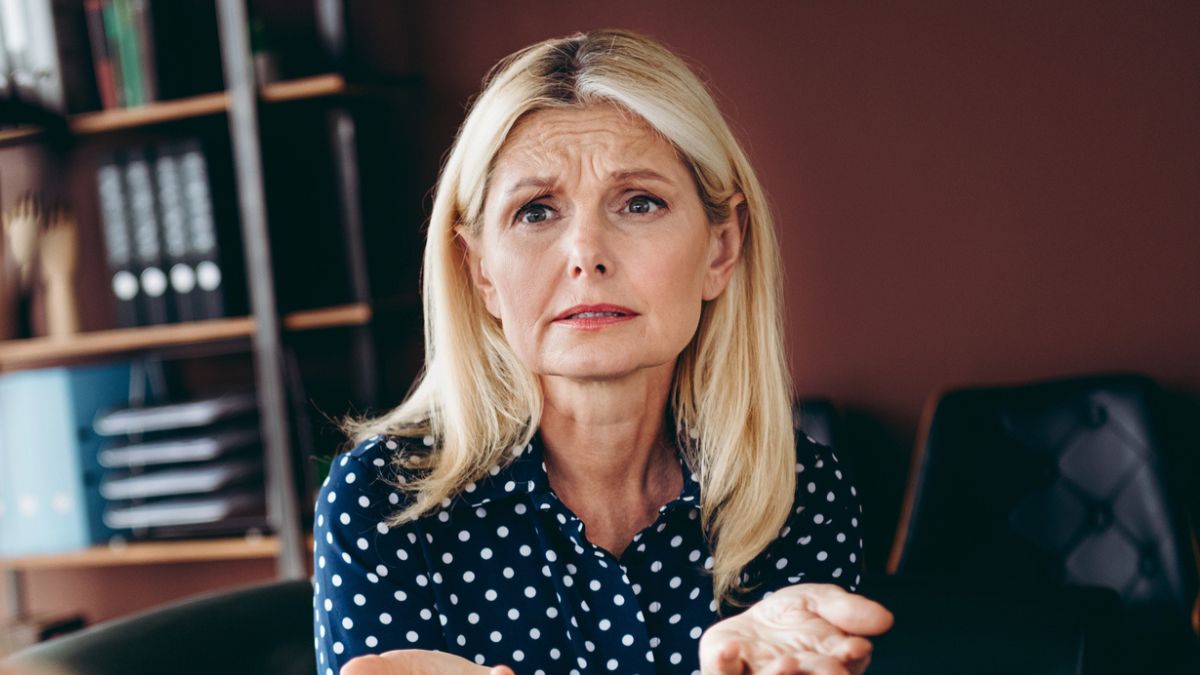 mature woman struggling in office