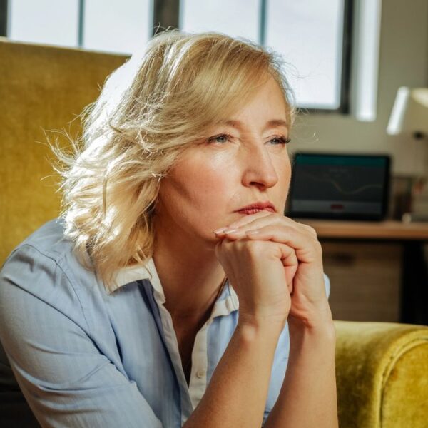 mature woman thinking to herself