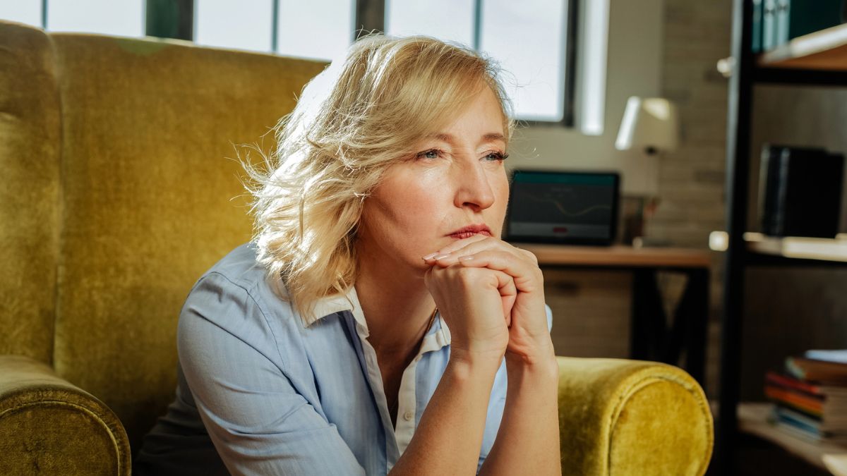 mature woman thinking to herself