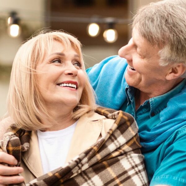 senior couple in front of a rv