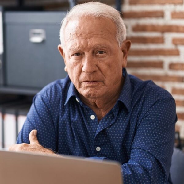 senior man at brick office