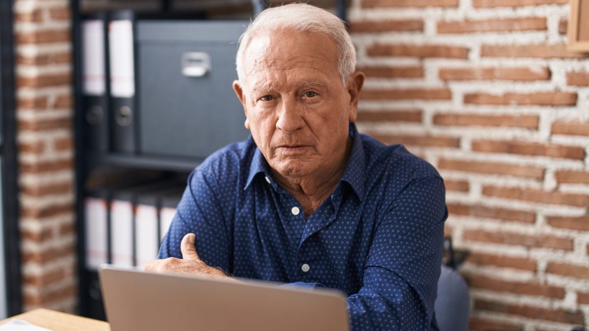 senior man at brick office