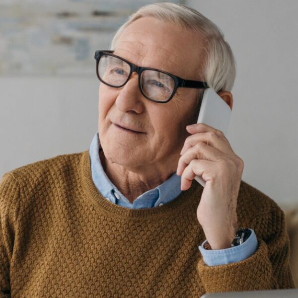 senior man on the phone laptop