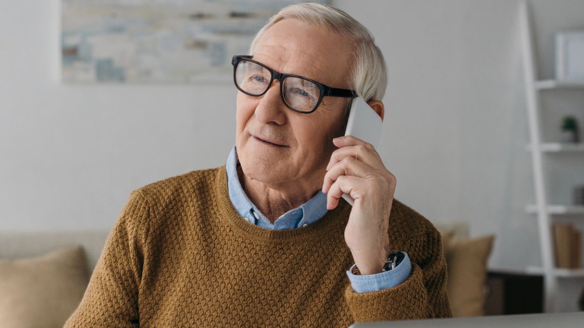 senior man on the phone laptop