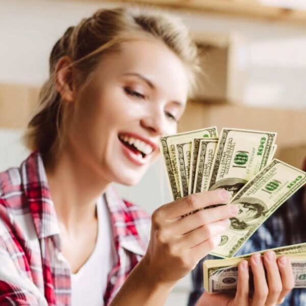 woman counting cash in flannel