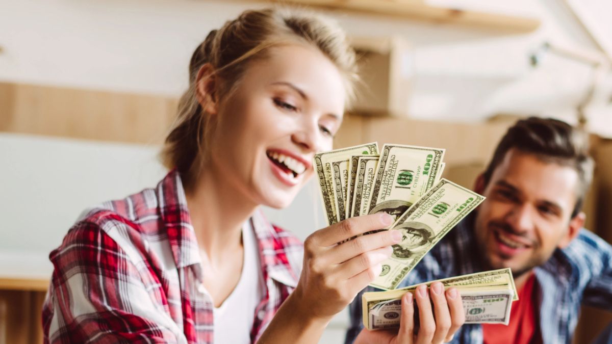 woman counting cash in flannel