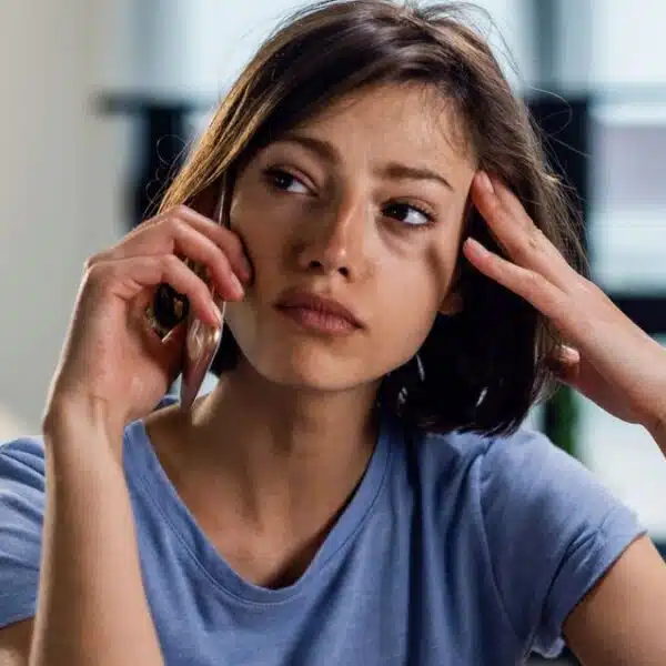 woman crying on the phone