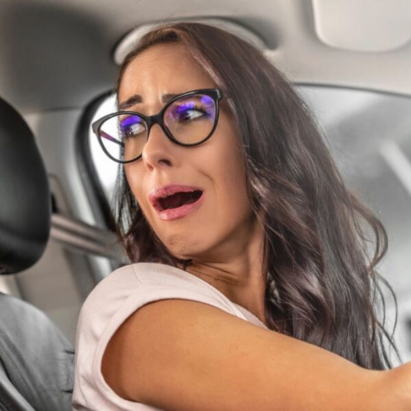 woman driving angry glasses