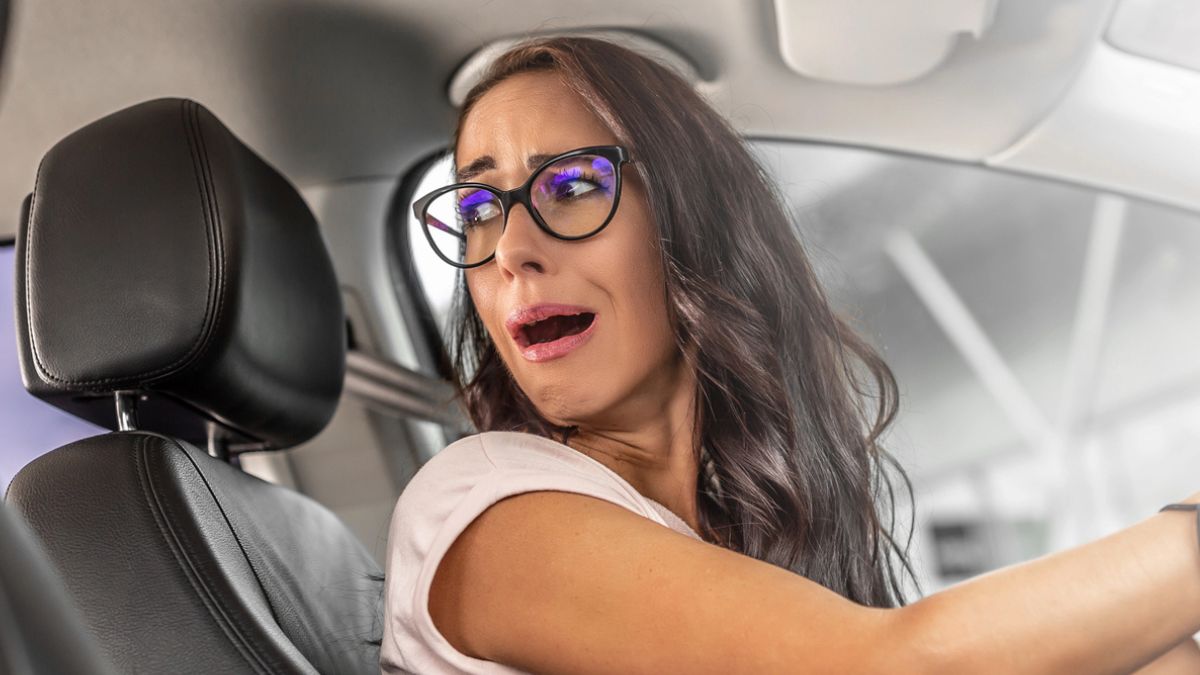woman driving angry glasses