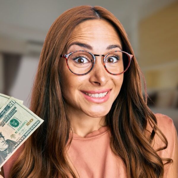 woman glasses holding cash in her room
