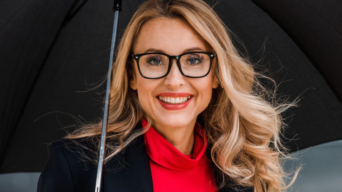 woman glasses umbrella smiling