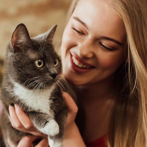 woman holding a cat