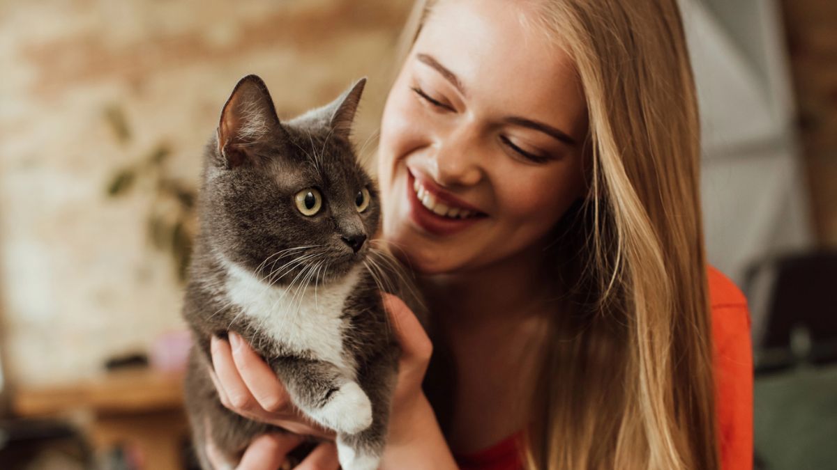 woman holding a cat