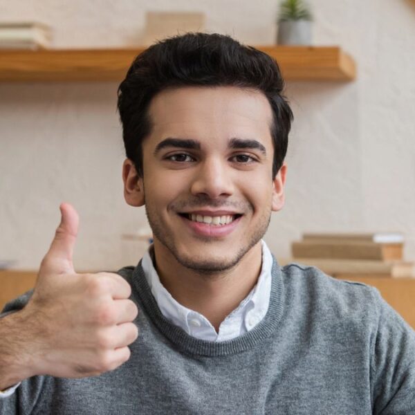 smiling man thumbs up