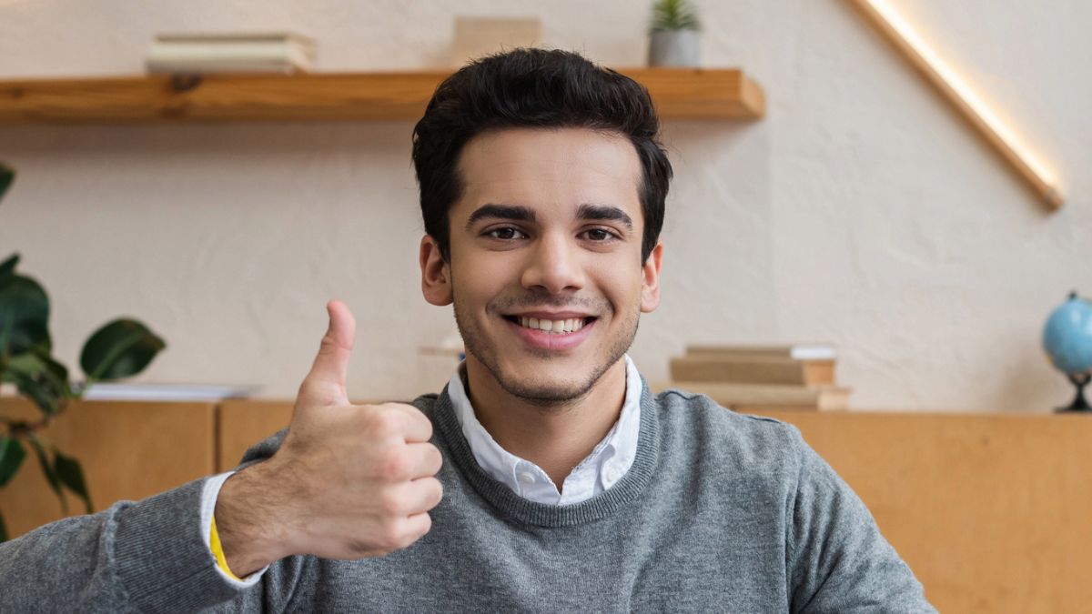 smiling man thumbs up