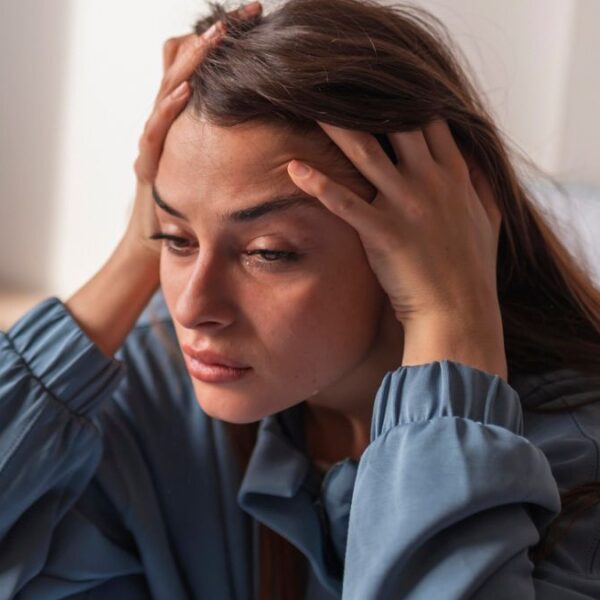 woman in pajamas sad