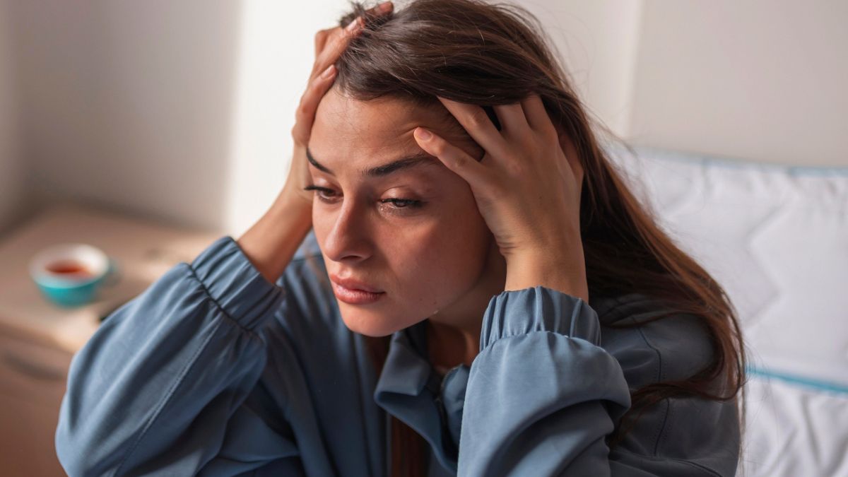 woman in pajamas sad