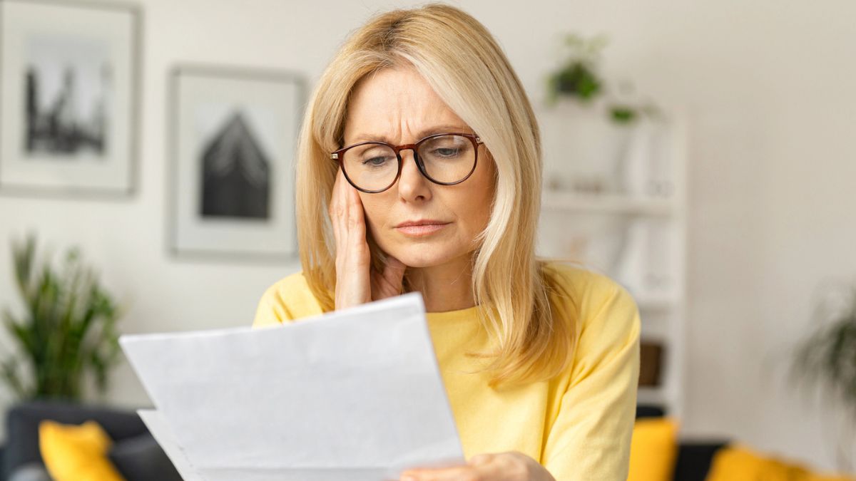 woman looking at her bill statements