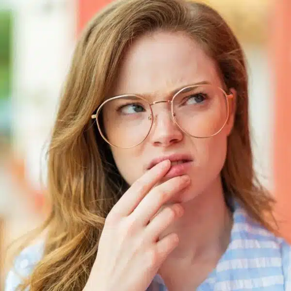 woman nervous wearing glasses