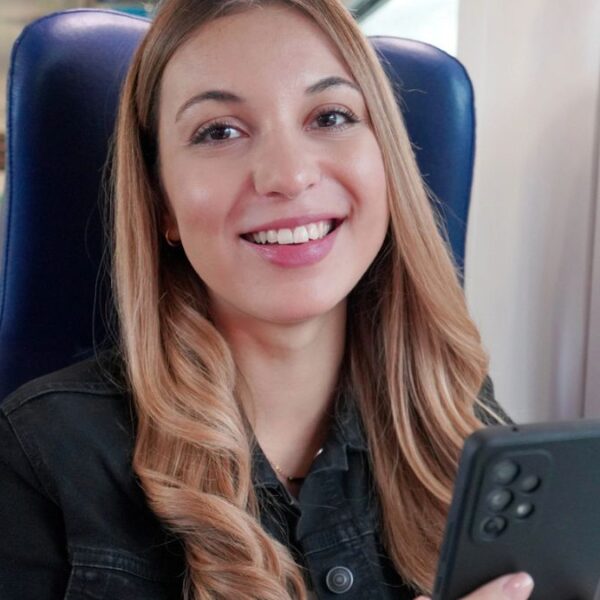 woman riding a train with a generator