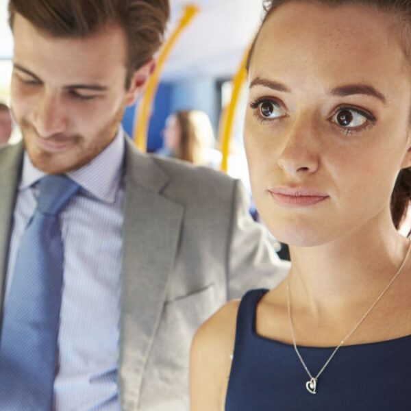 woman riding on public transit
