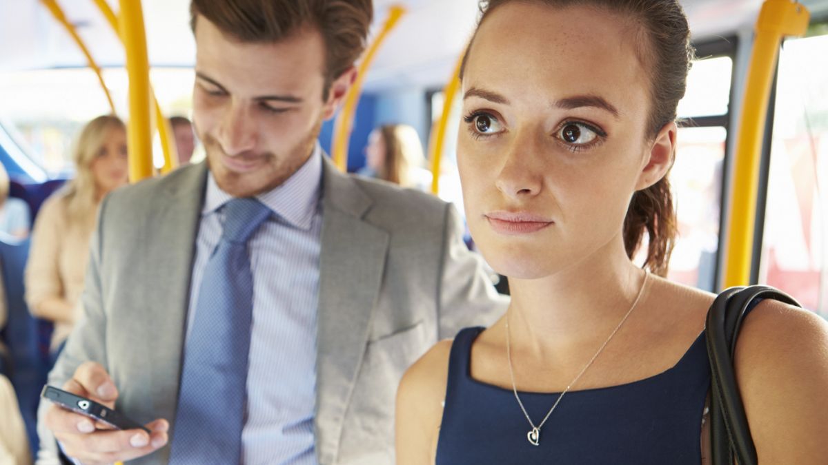 woman riding on public transit