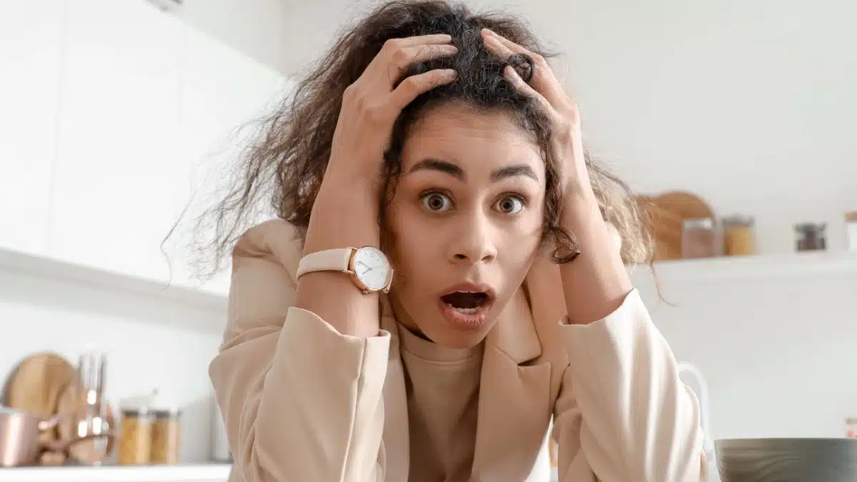 woman shocked in her kitchen