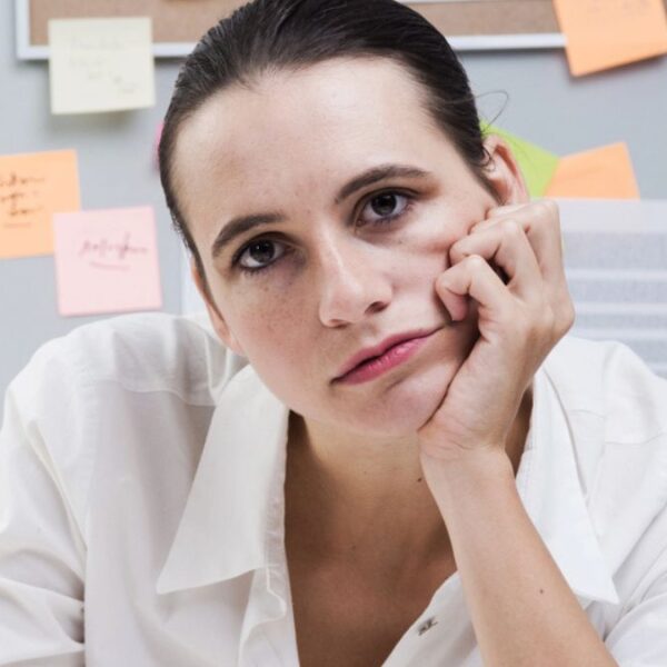woman sitting at her desk
