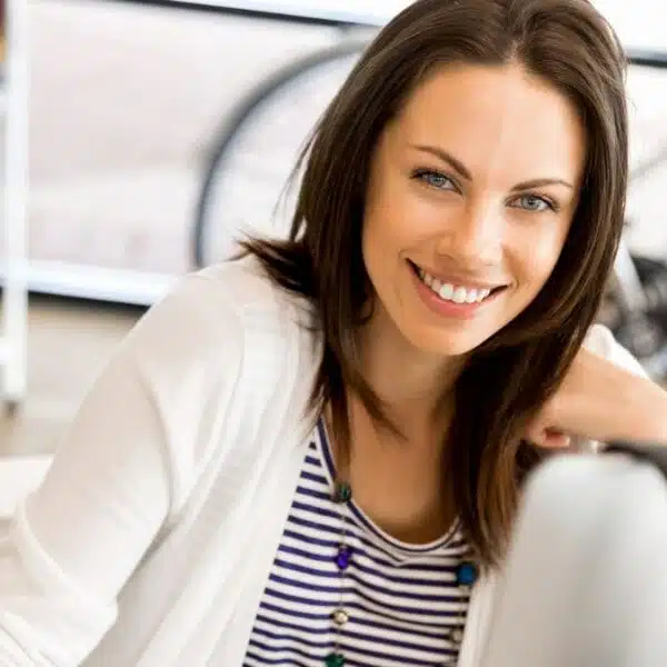 woman smiling in her home office