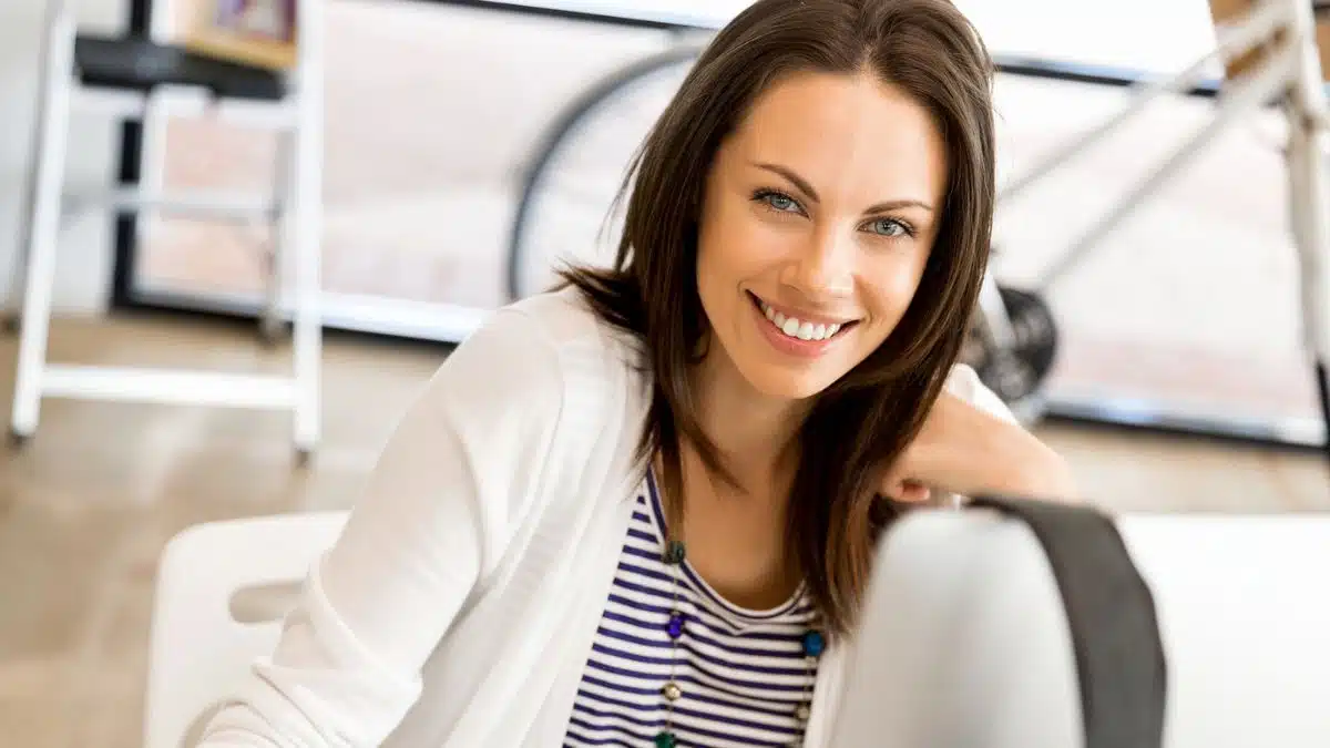 woman smiling in her home office