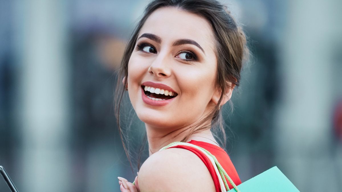 woman smiling shopping outside