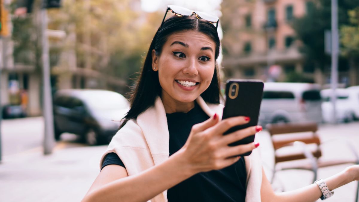 woman smiling with phone