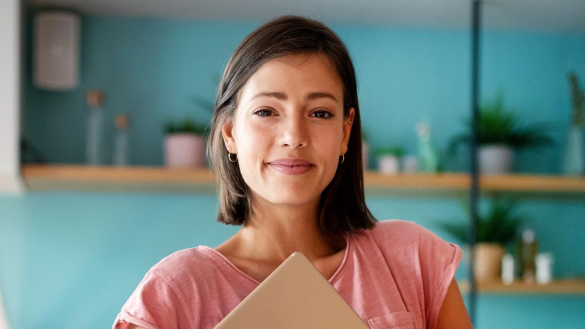woman smirking in her home office