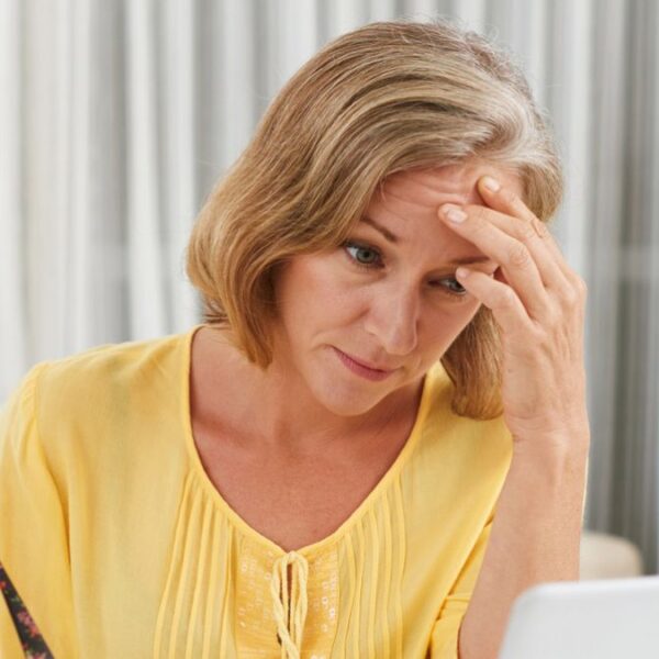 woman staring at her bills