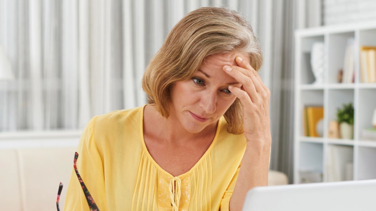 woman staring at her bills