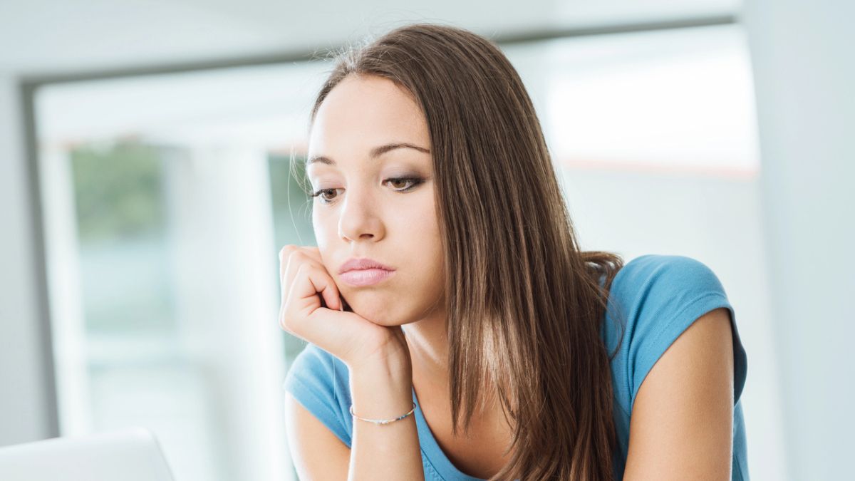 woman thinking in kitchen