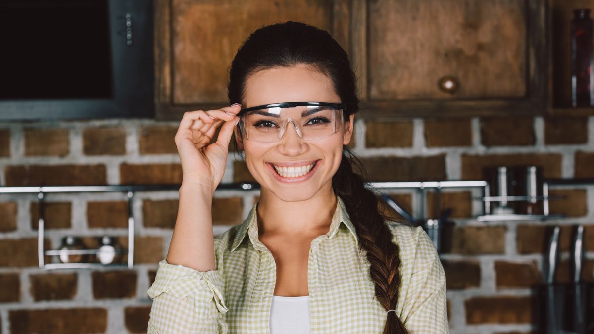 woman with goggles in kitchen