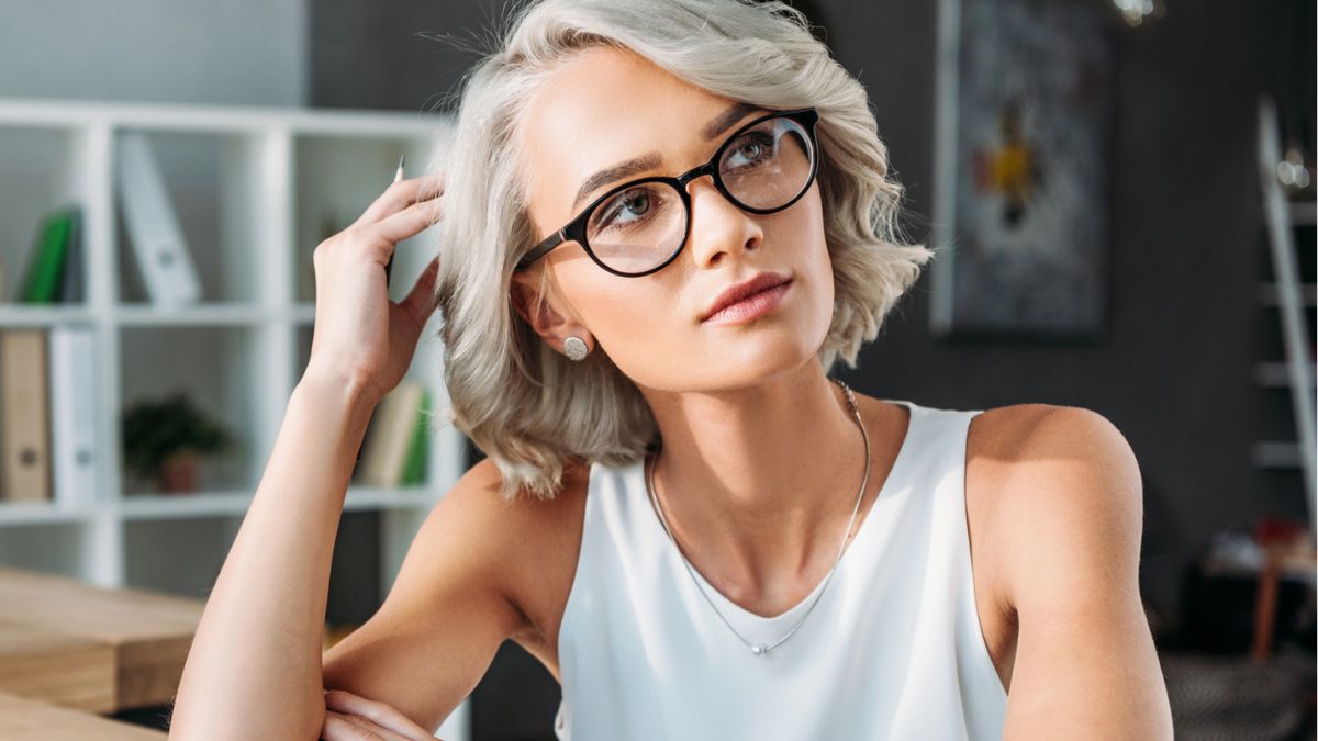 woman working alone glasses