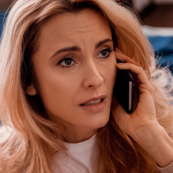woman worried on the phone
