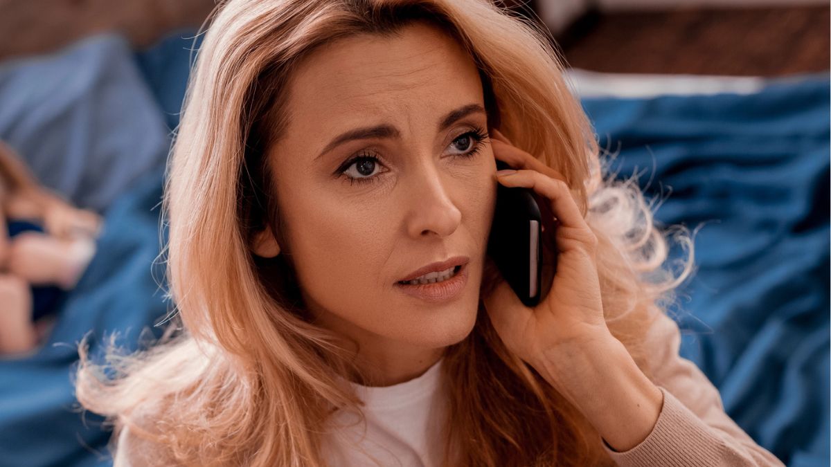 woman worried on the phone