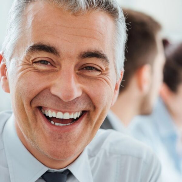 worker smiling at desk