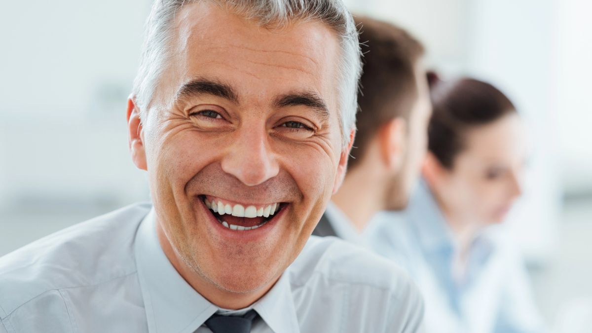 worker smiling at desk