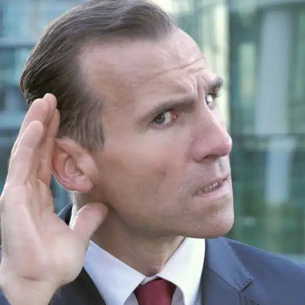 business man listening to secret